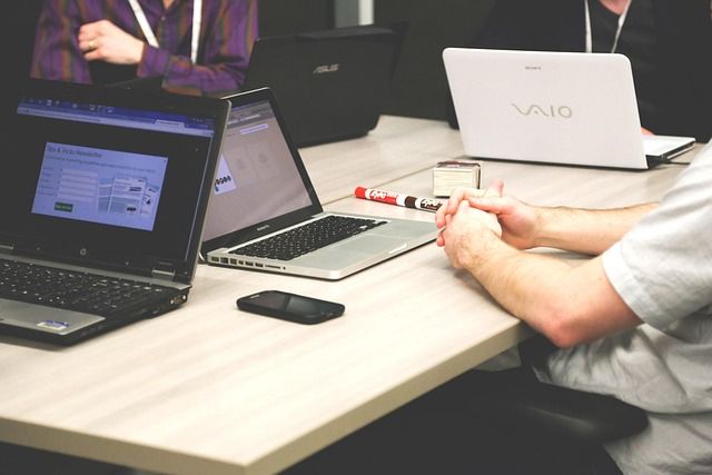 A group of colleagues sitting together in a conference room for a meeting.