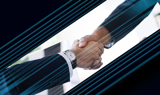 A happy client shaking hands with a business partner.