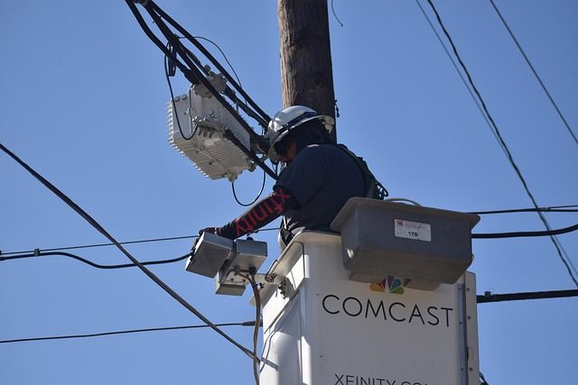 A technician checking network cables.