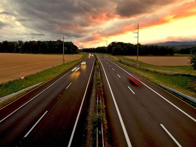 A car driving on a spacious city freeway.