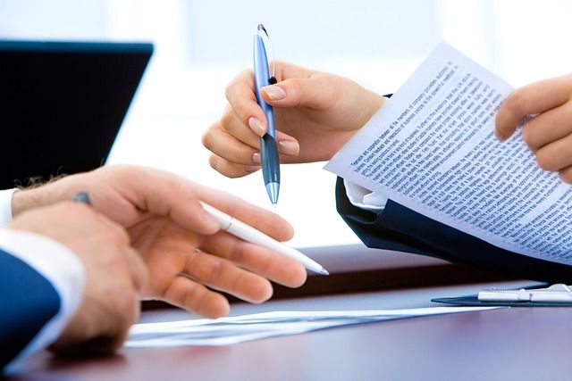 A thick paper dossier document folder resting on a desk.