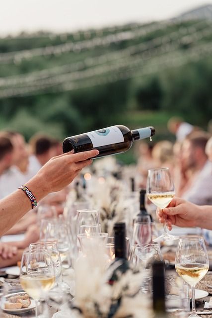 Business partners raising glasses to propose a toast during a formal dinner